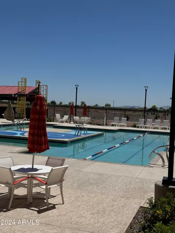 a living room with lots of furniture and a chandelier