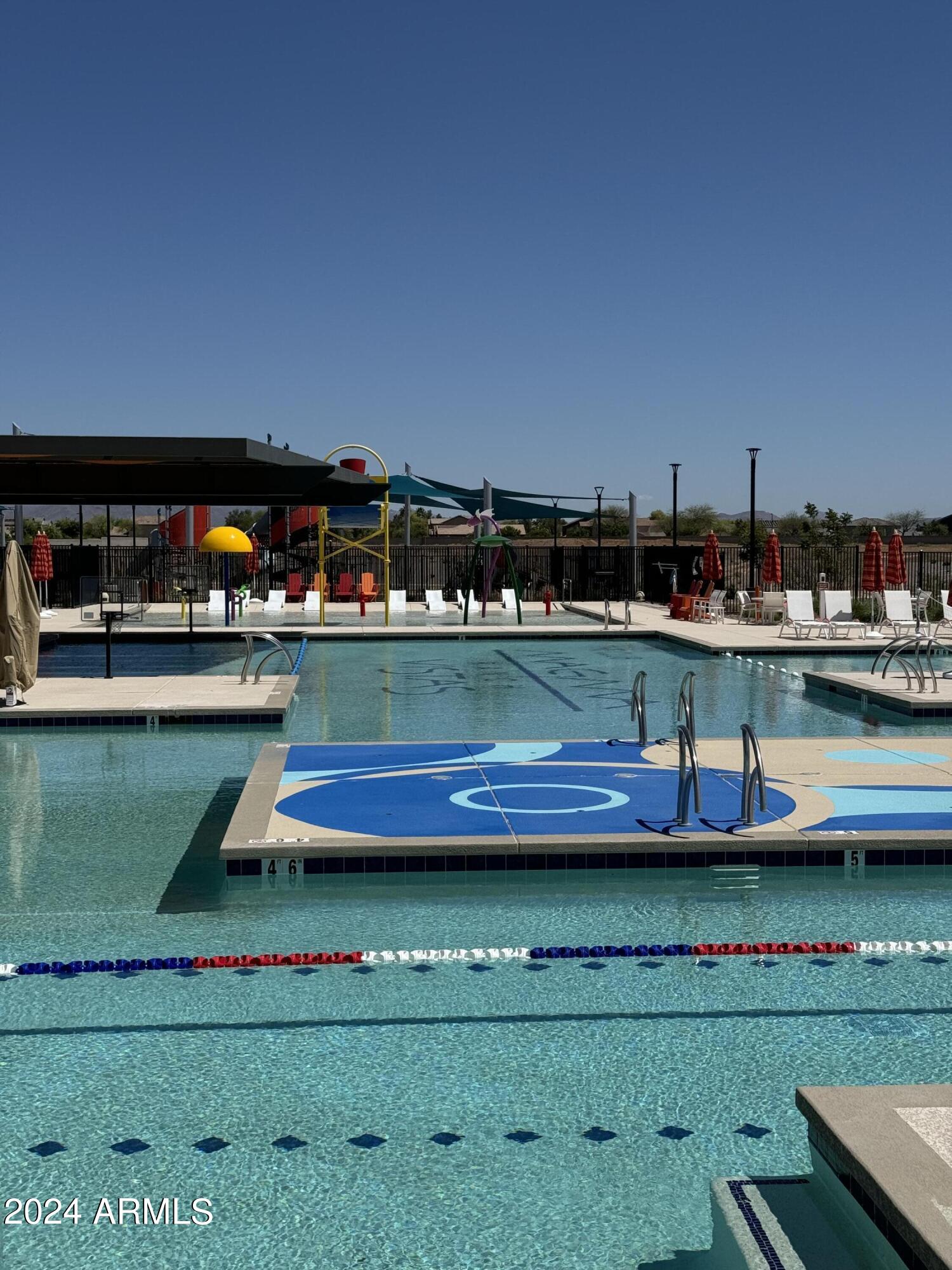 12088 East Verbina Lane Florence, AZ 85132 - Photo 40 of 48 a view of swimming pool with outdoor seating
