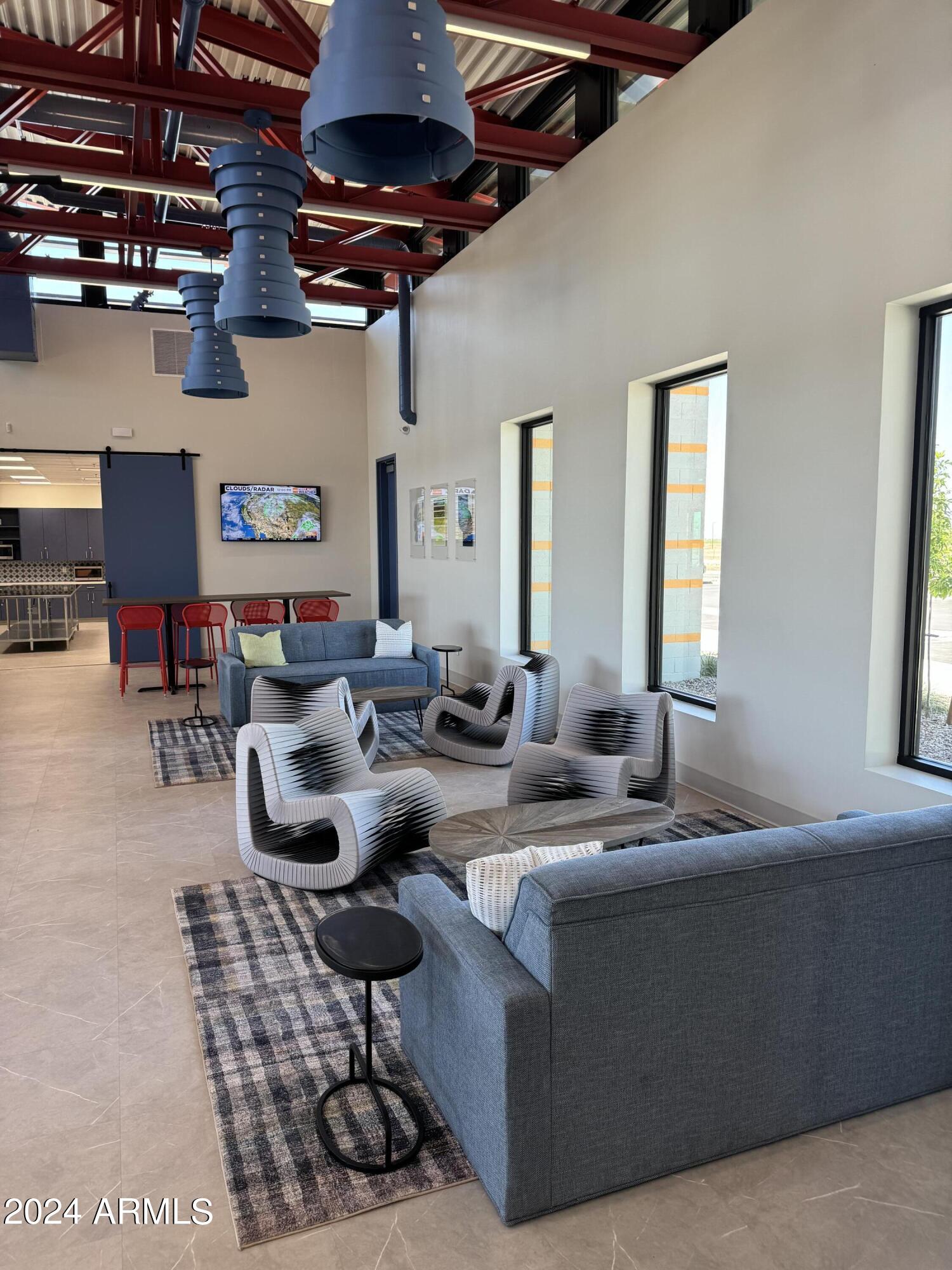 12088 East Verbina Lane Florence, AZ 85132 - Photo 45 of 48 a living room with lots of furniture and a chandelier