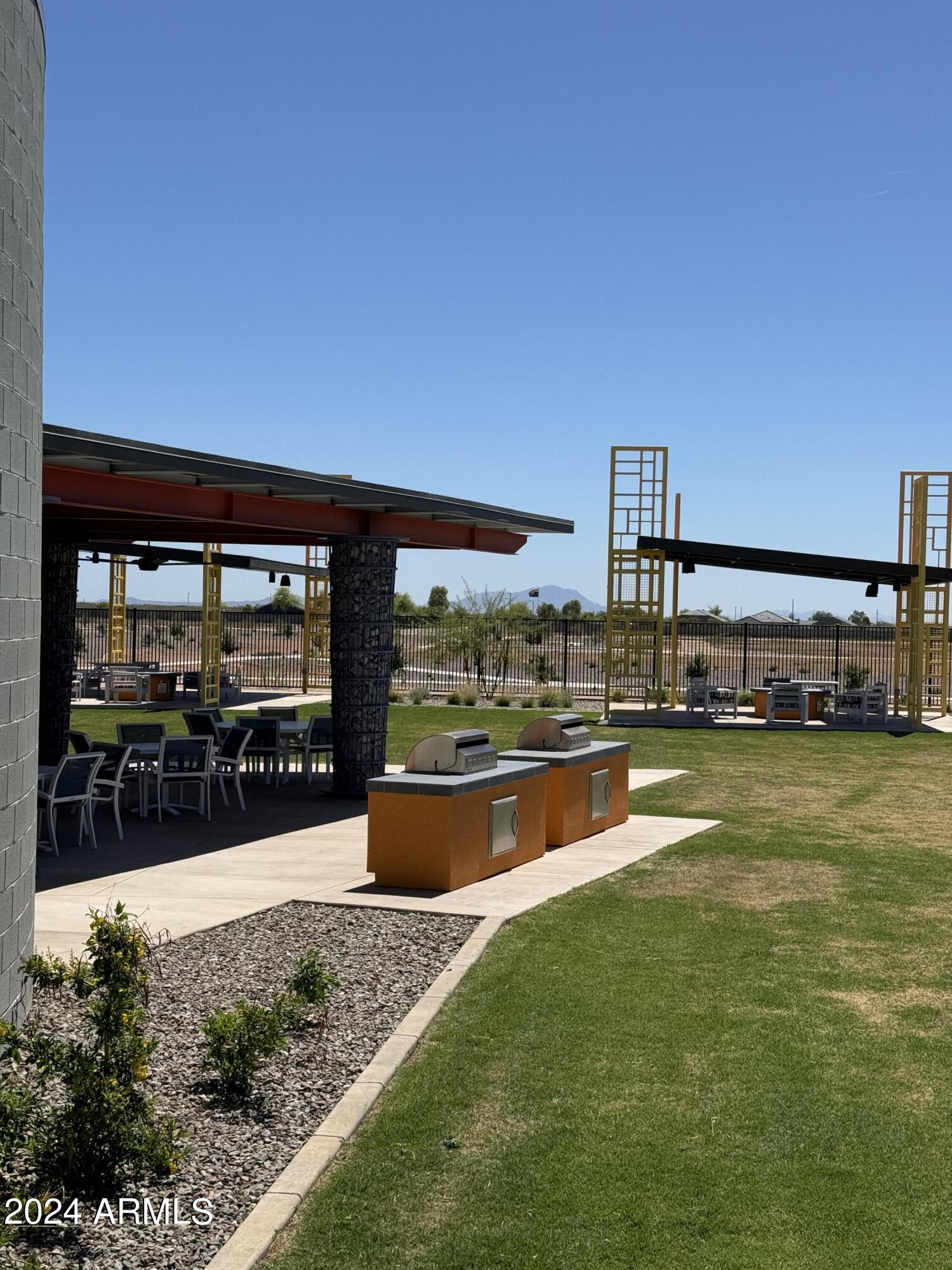 12088 East Verbina Lane Florence, AZ 85132 - Photo 48 of 48 a view of a swimming pool with an outdoor seating