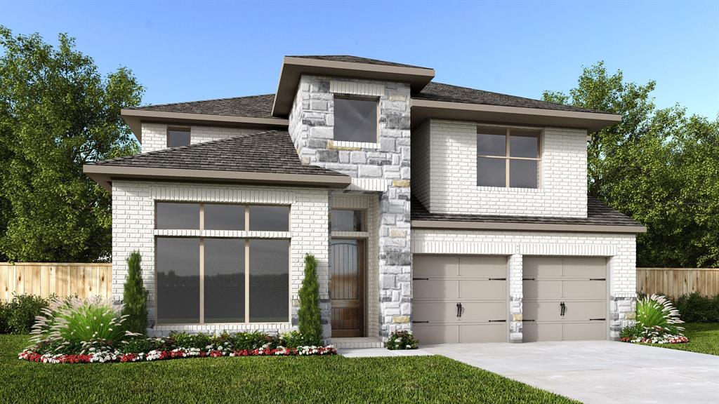 704 Duke Lane Celina, TX 75009 - Photo 1 of 4 a front view of a house with a garden and yard