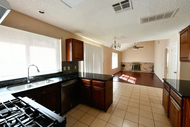 a kitchen with a sink and a refrigerator