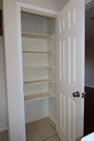 a view of a room with racks on the wall