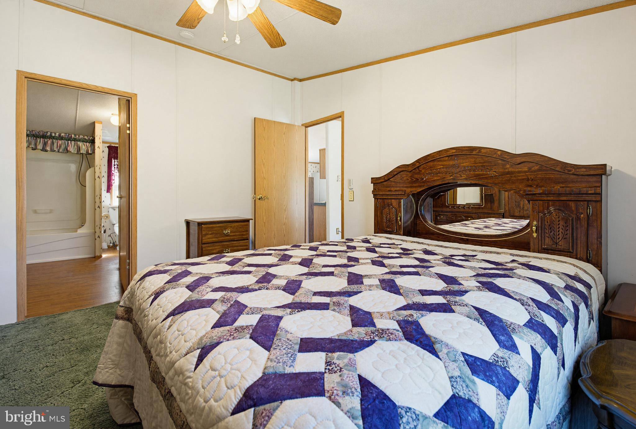 315 Lewis Road Annville, PA 17003 - Photo 24 of 33 a bedroom with a bed and a lamp on dresser