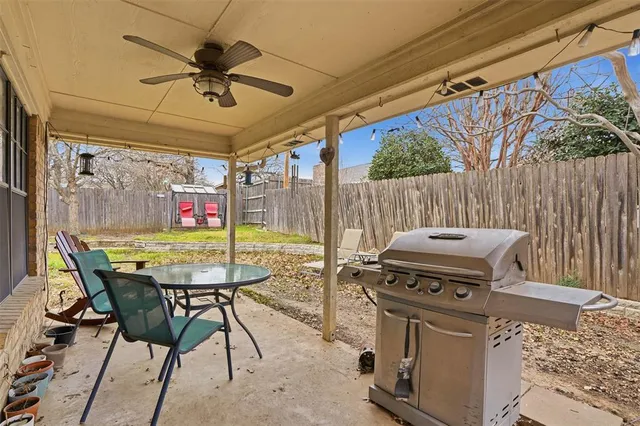a view of a chairs and table in the patio