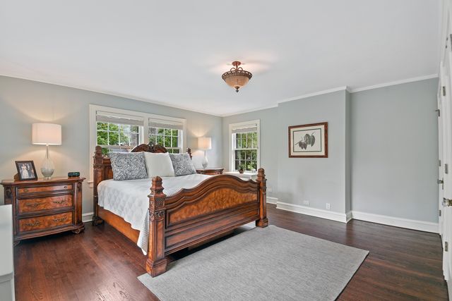 a bedroom with a bed and a night stand