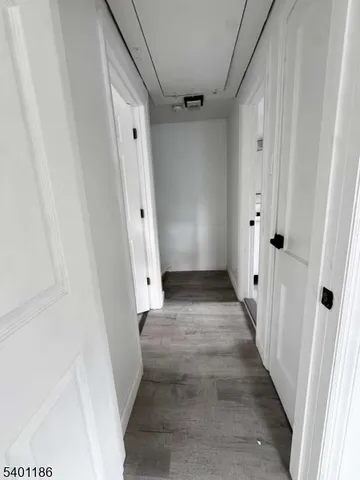 a view of bedroom with wooden floor