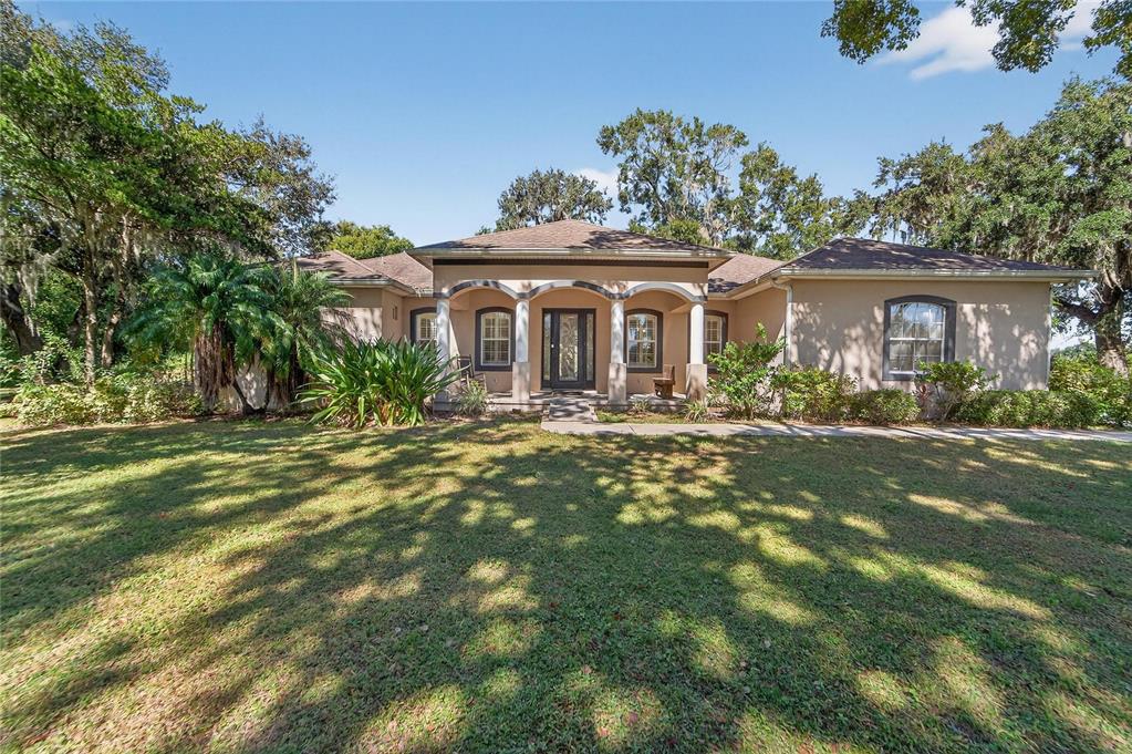 332 Holloway Road Plant City, FL 33567 - Photo 1 of 1 a front view of a house with a garden