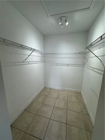 a view of a storage and utility room with racks on the wall