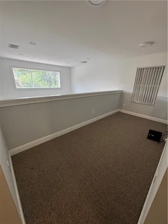 a view of a room with a large window