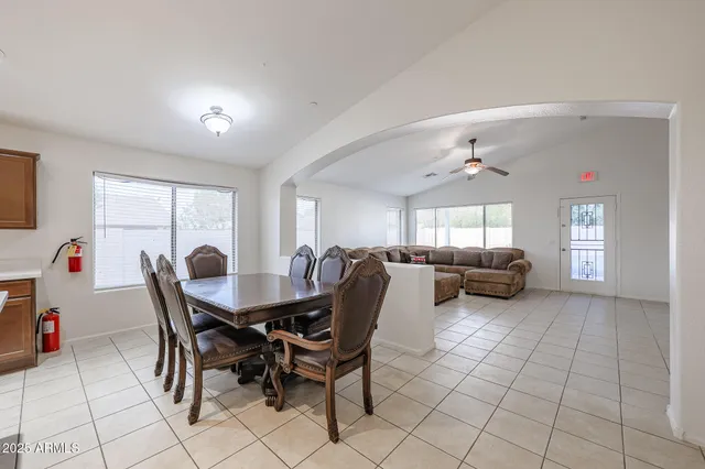 a large kitchen with a large counter top appliances and cabinets