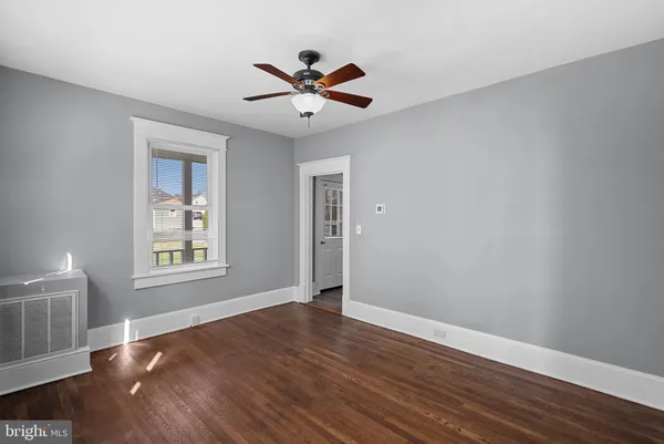 a kitchen with a sink a refrigerator and cabinets
