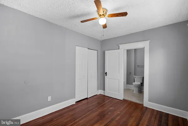 a bathroom with a bathtub and a toilet