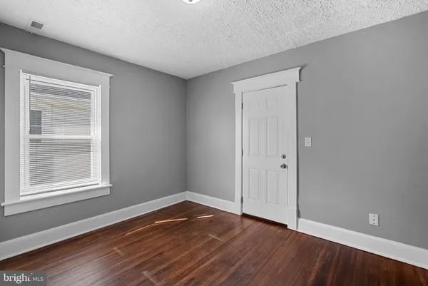 a white bath tub sitting next to a window