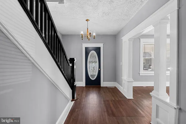 a view of entryway with wooden floor