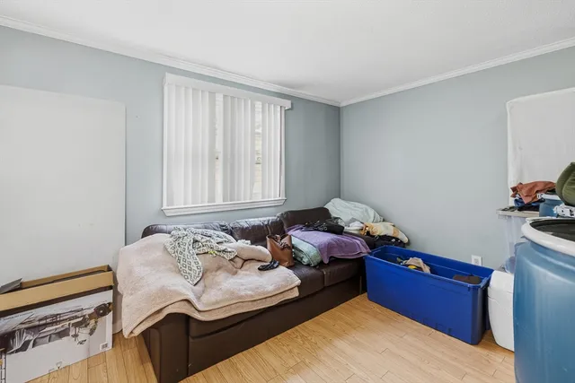 a bedroom with furniture and a window