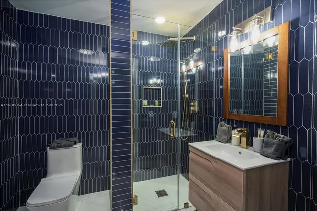 a view of a balcony with dining table and chairs