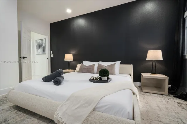 a media room with lots of chairs and wooden floor