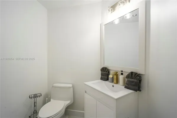 a row of palm trees sitting in front of a house