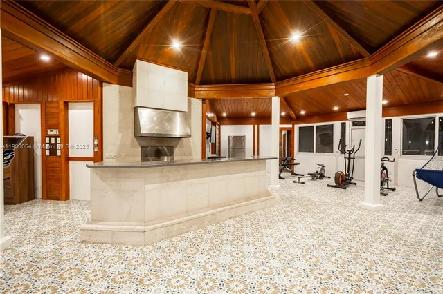 an aerial view of residential houses with outdoor space and river