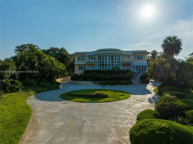 an aerial view of a house swimming pool patio and outdoor seating