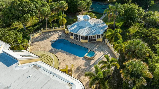 a view of a chairs and table in a patio