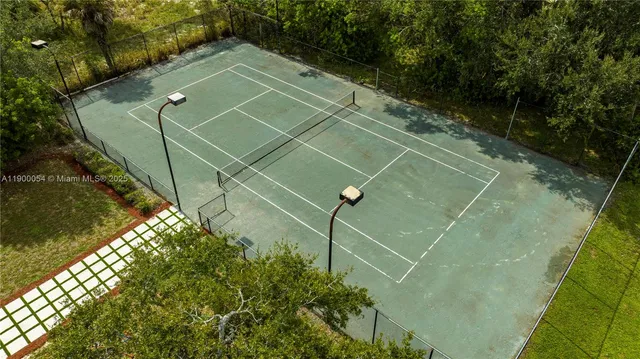 a view of an chairs and table in the patio