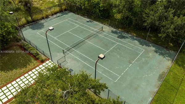 an aerial view of a house swimming pool patio and outdoor seating