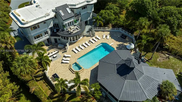 a view of a chairs and table in patio
