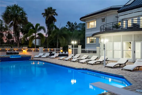 swimming pool view with a garden space