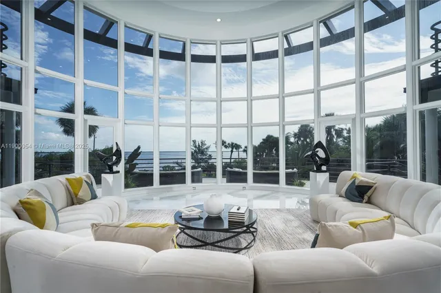 a large kitchen with kitchen island a table and chairs in it