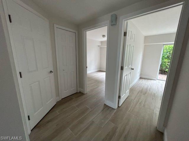 1555 Blue Point Avenue, Unit 2 Naples, FL 34102 - Photo 3 of 10 Hall with light hardwood / wood-style floors