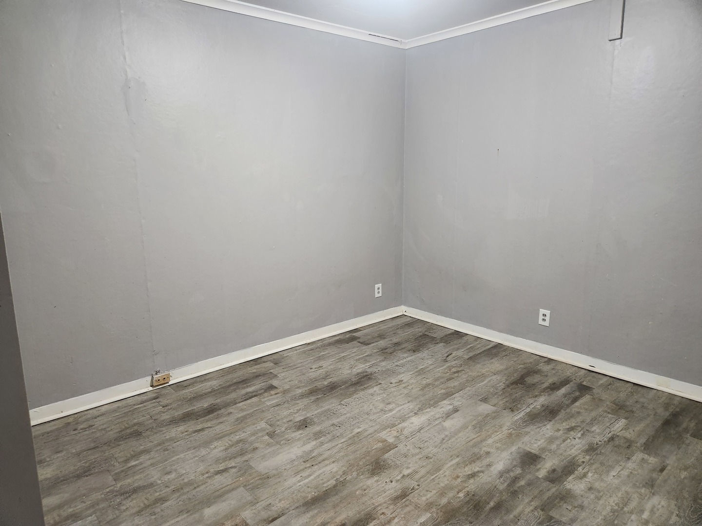 8 East Railroad Street, Unit 9 Sandwich, IL 60548 - Photo 5 of 8 a room with an empty space and wooden floor