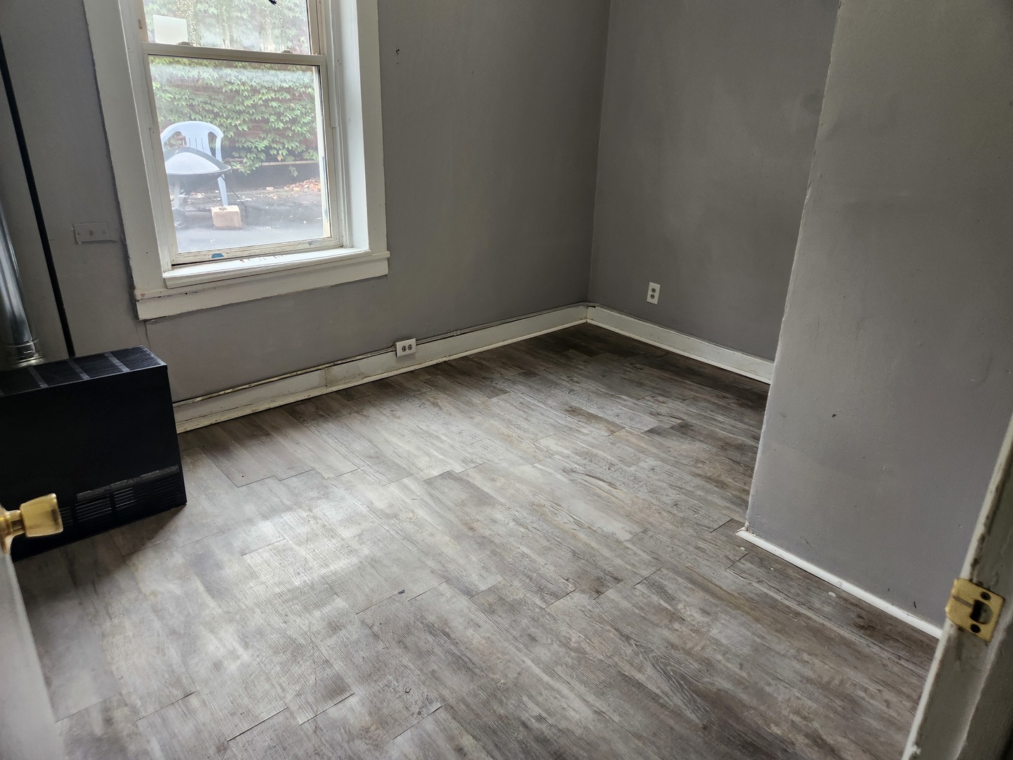 8 East Railroad Street, Unit 9 Sandwich, IL 60548 - Photo 6 of 8 an empty room with a window