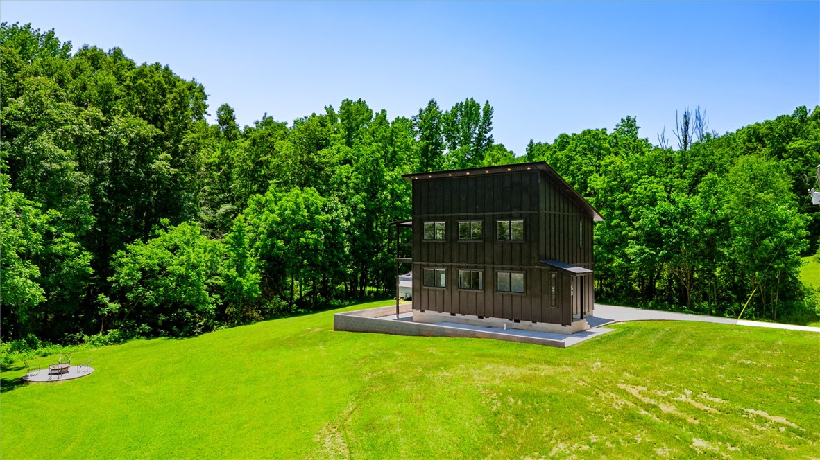 159 Cherokee Trail Easley, SC 29640 - Photo 37 of 38 A modern facade with plentiful surrounding greenery, this home offers tranquil, wooded views.