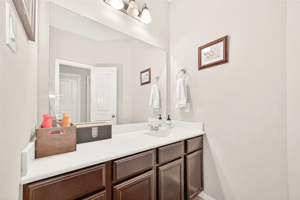 a bathroom with a granite countertop sink mirror and double