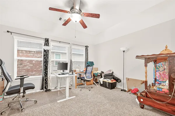 a backyard view with a seating space