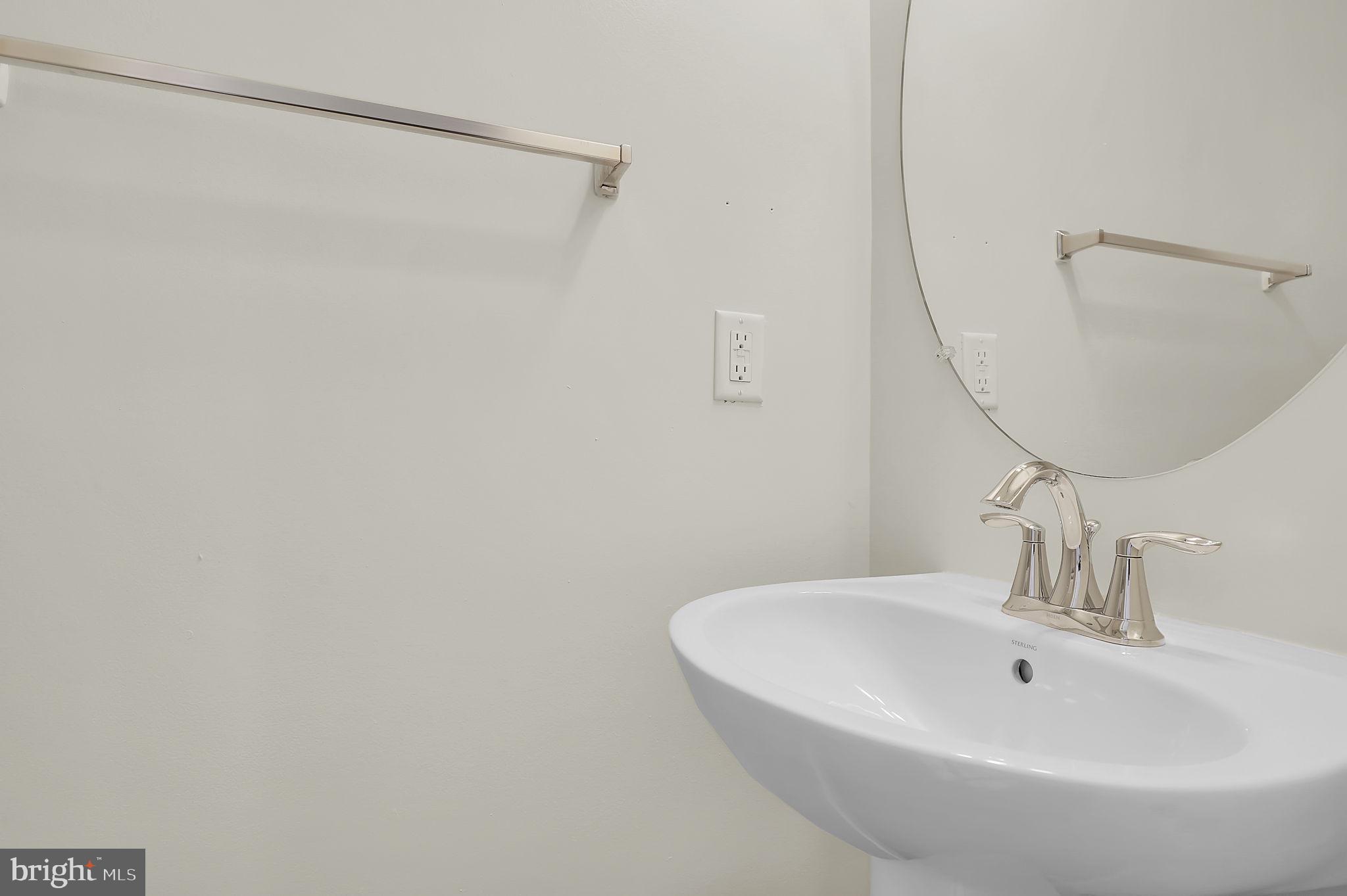 5906 Krantz Drive Frederick, MD 21703 - Photo 12 of 40 a bathroom with a sink and a mirror