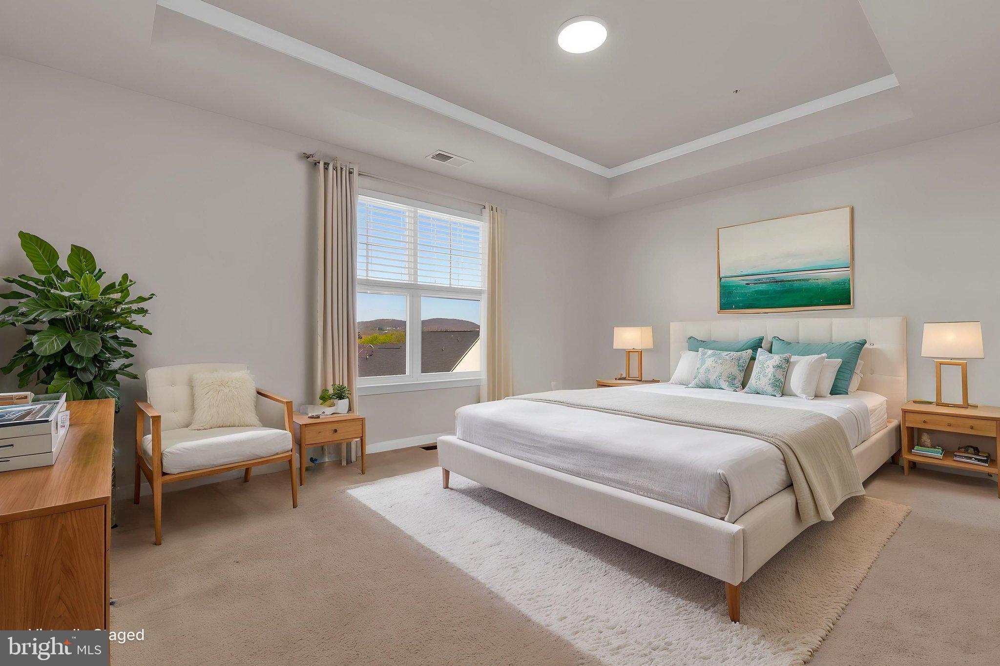 5906 Krantz Drive Frederick, MD 21703 - Photo 21 of 40 a spacious bedroom with a bed and a couch