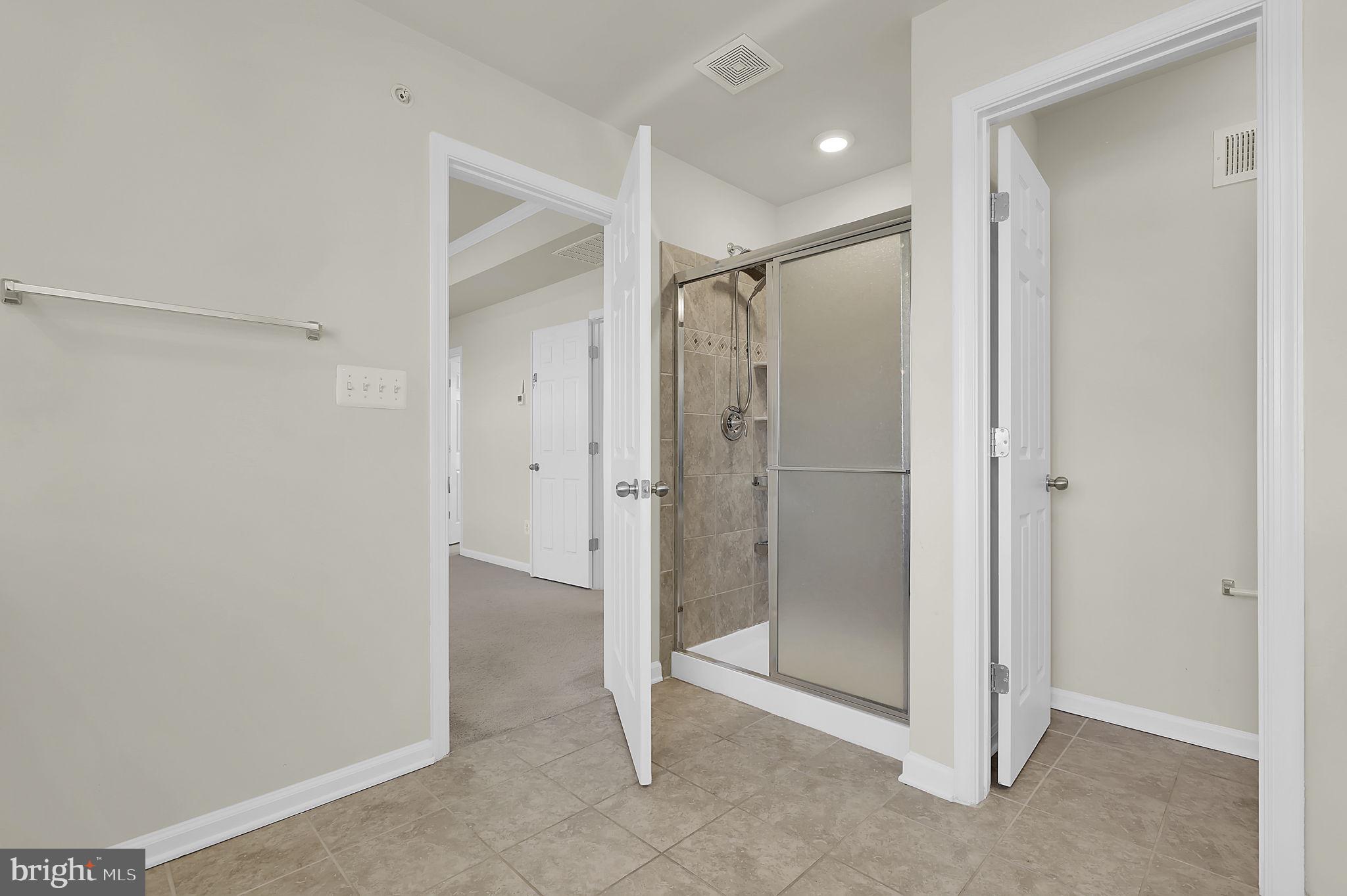 5906 Krantz Drive Frederick, MD 21703 - Photo 25 of 40 a bathroom with a shower and a glass door