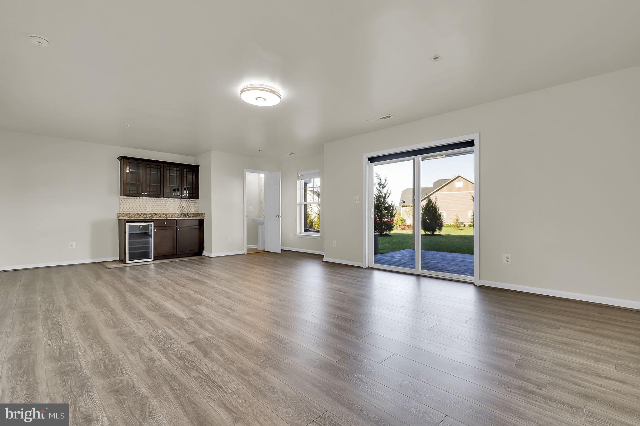 5906 Krantz Drive Frederick, MD 21703 - Photo 26 of 40 a view of a livingroom with wooden floor and furniture