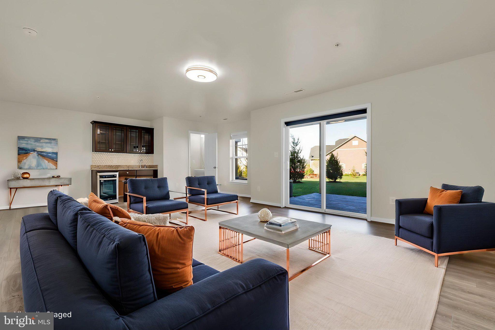 5906 Krantz Drive Frederick, MD 21703 - Photo 27 of 40 a living room with fireplace furniture and a flat screen tv