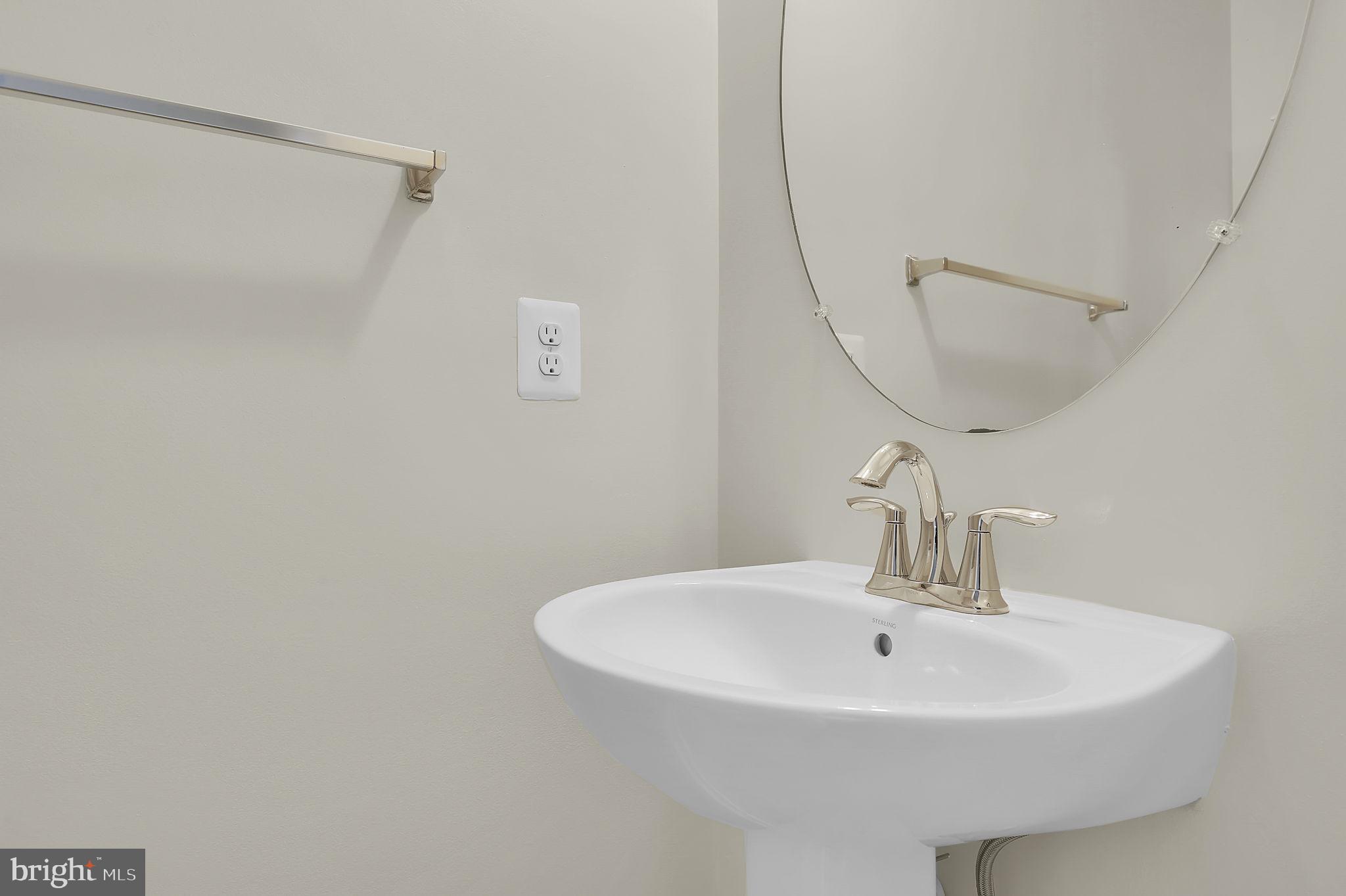 5906 Krantz Drive Frederick, MD 21703 - Photo 29 of 40 a bathroom with a sink and a mirror
