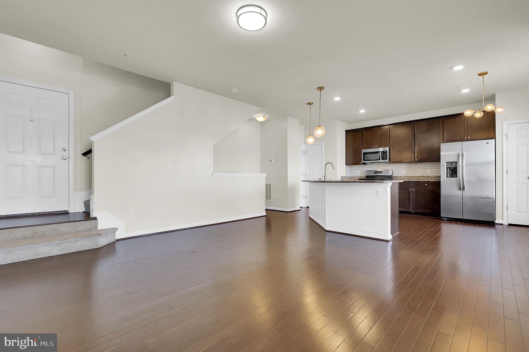 5906 Krantz Drive Frederick, MD 21703 - Photo 5 of 40 a view of kitchen with wooden floor and electronic appliances