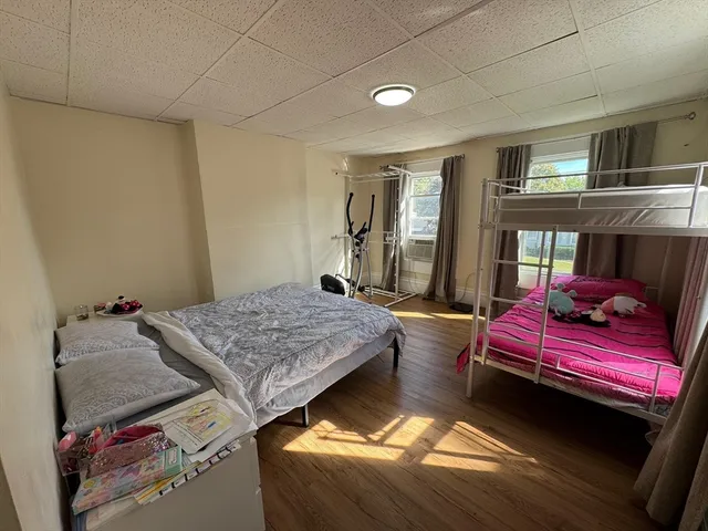 a bedroom with bed and window