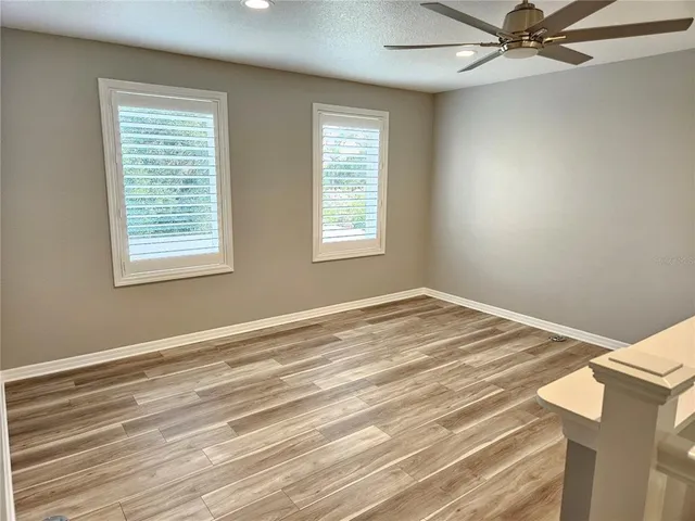 a view of a livingroom with wooden floor and closet