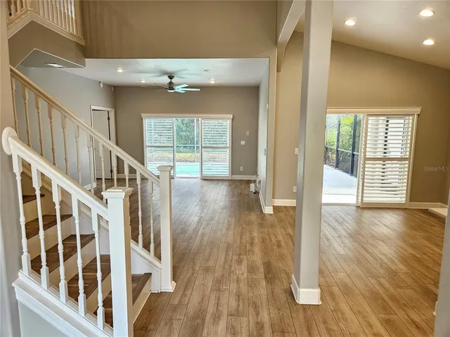 a view of an entryway with wooden floor