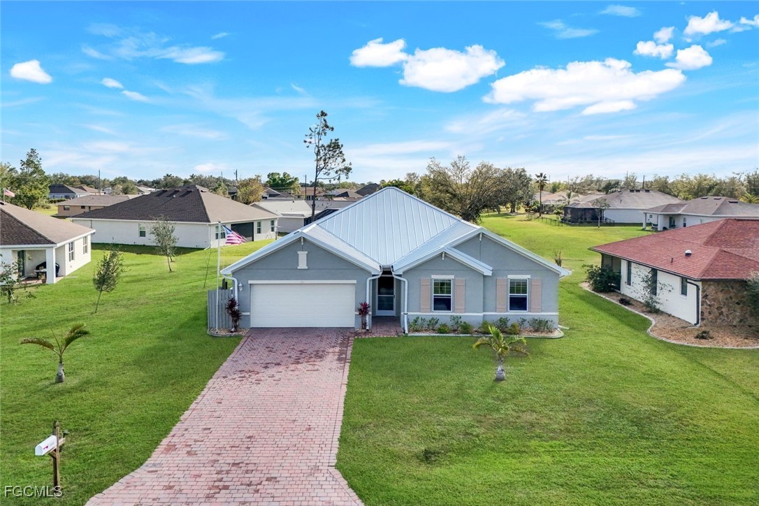 a aerial view of a house with a big yard