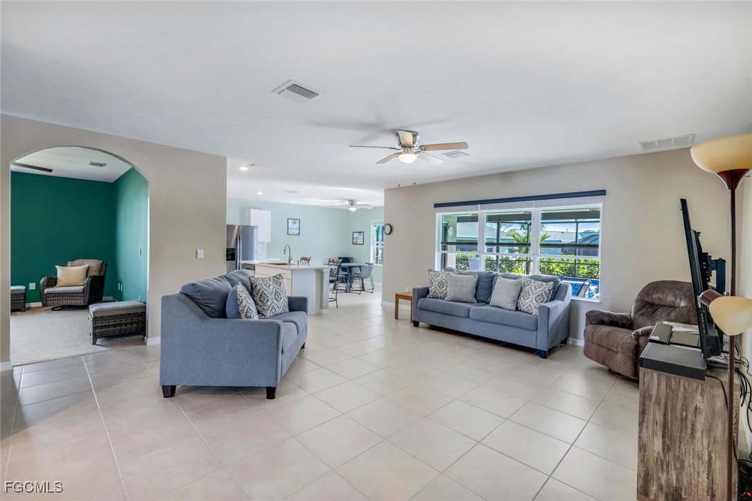566 Corrientes Circle Punta Gorda, FL 33983 - Photo 11 of 36 a living room with furniture and a large window
