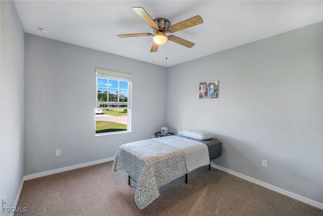 566 Corrientes Circle Punta Gorda, FL 33983 - Photo 24 of 36 a bedroom with a bed and window